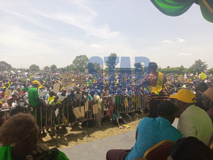 Kirinyaga residents at the 'Kenya Kwanza' rally at Thiba ground in Mwea Kirinyaga county. PHOTO/WANGECHI WANG'ONDU