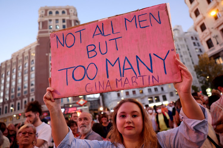 People hold banners and protest in Madrid following a kiss between Royal Spanish Football Federation President Luis Rubiales and Spain's Jennifer Hermoso after the Women's World Cup final.