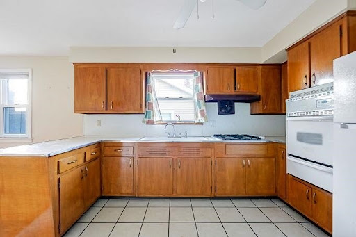 Kitchen with wooden cabinets and countertop in this luxury apartment / penthouse for sale in North Caldwell ($1,150,000)