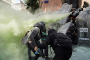 Members of a feminist collective clash with police officers during a march to mark the International Safe Abortion Day in Mexico City. 