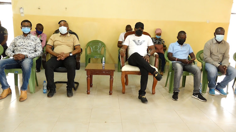 Kilifi MCAs Gilbert Peru (Sokoni Ward) Hassan Mohamed (Matsangoni) with Governor Amason Kingi and Shimo la Tewa MCA Sammy Ndago during issuance of letter of allotment at Chumani in Kilifi county.