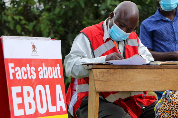 Aid workers carrying on sensitization activities about Ebola.