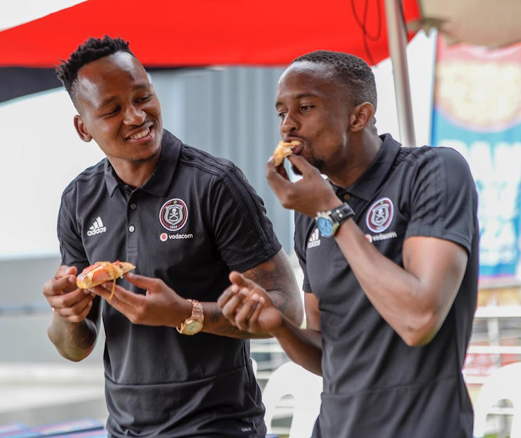 Orlando Pirates goalkeeper Brilliant Khuzwayo and Linda Mntambo.