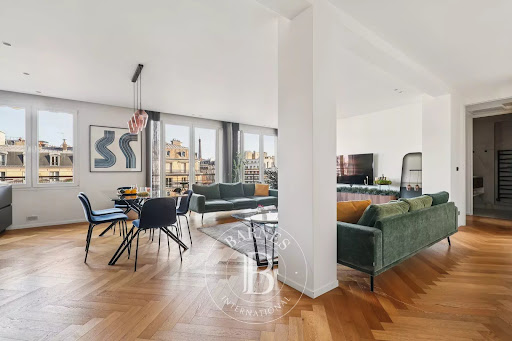 Living dining room with parquet floor in this luxury apartment / penthouse for sale in Paris 16ème ($1,581,310 - 74 m²)