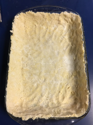 Spread dough along the bottom and sides of the baking dish