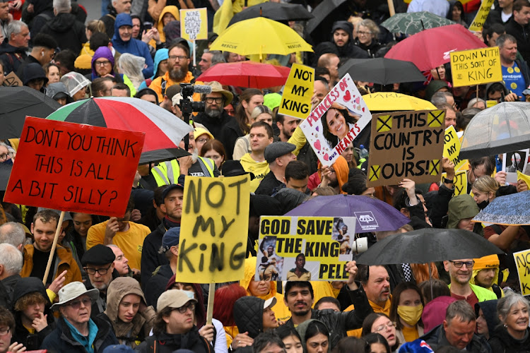 Protesters gather amongst well-wishers ahead of the Coronation of King Charles III and Queen Camilla on May 6, 2023 in London, England. The Coronation of Charles III and his wife, Camilla, as King and Queen of the United Kingdom of Great Britain and Northern Ireland, and the other Commonwealth realms takes place at Westminster Abbey today. Charles acceded to the throne on 8 September 2022, upon the death of his mother, Elizabeth II.