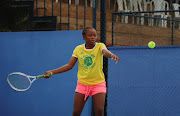 Manantsop Delisle, 14, a young tennis player and intern, trains at Oyebog, a tennis academy for young, disadvantaged players founded by Joseph Oyebog, a former Cameroonian tennis champion, in Souza, Cameroon April 29, 2023. 