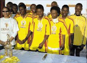 GUESTS: Players representing OBC, the team that came third, with DBSA spokesman Nonie Letsholo. © Unknown.