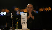 A Buddhist monk prays during the Japanese ceremony 