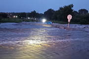 A female motorist who was trapped inside a car in a flooded road in Centurion has been rescued unharmed.