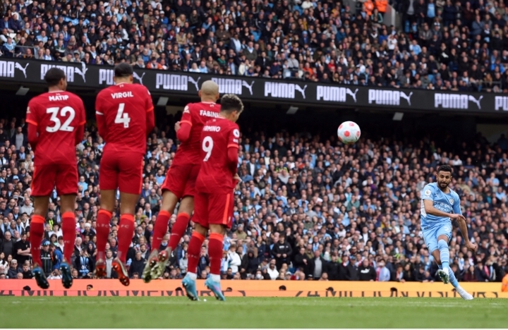 Manchester City's Riyad Mahrez shoots at goal from a free kick