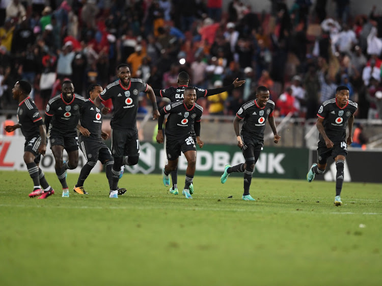 Orlando Pirates players celebrate their penalty shootout win against Dondol Stars in the Nedbank Cup quarter final at Peter Mokaba Stadium on Saturday.