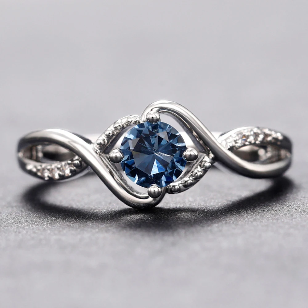 Title 6, Anello con zirconi diamante blu a forma di onda...