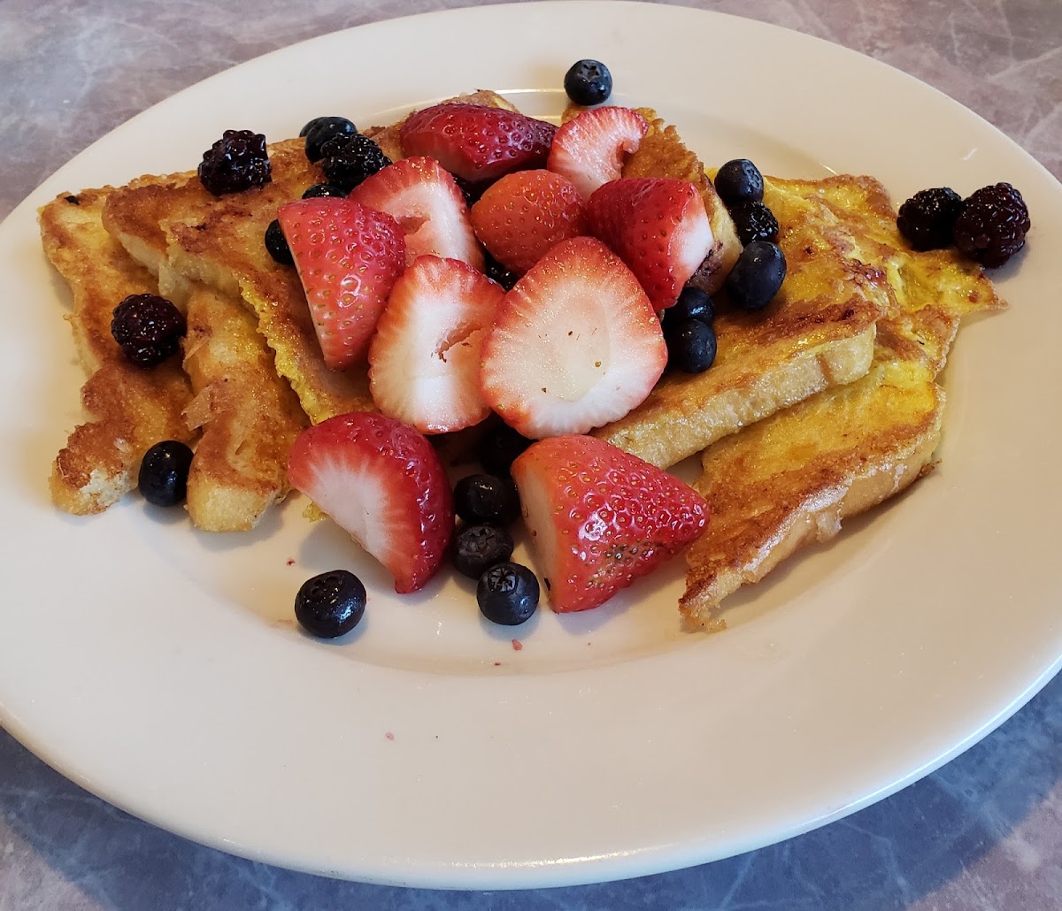 Gluten free French toast with three berry medley