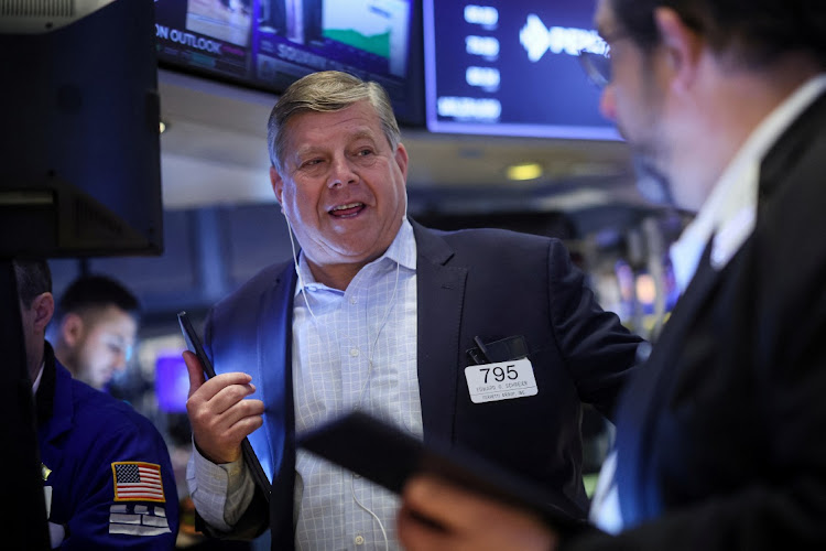 Traders work on the floor at the New York Stock Exchange in New York City, New York, US. File photo: BRENDAN MCDERMID/REUTERS