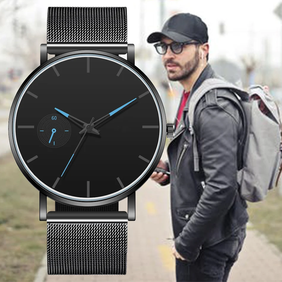 Heren horloge met nep monokel, Romeinse schaal en mesh band. Elegantie en een uniek design voor de man.