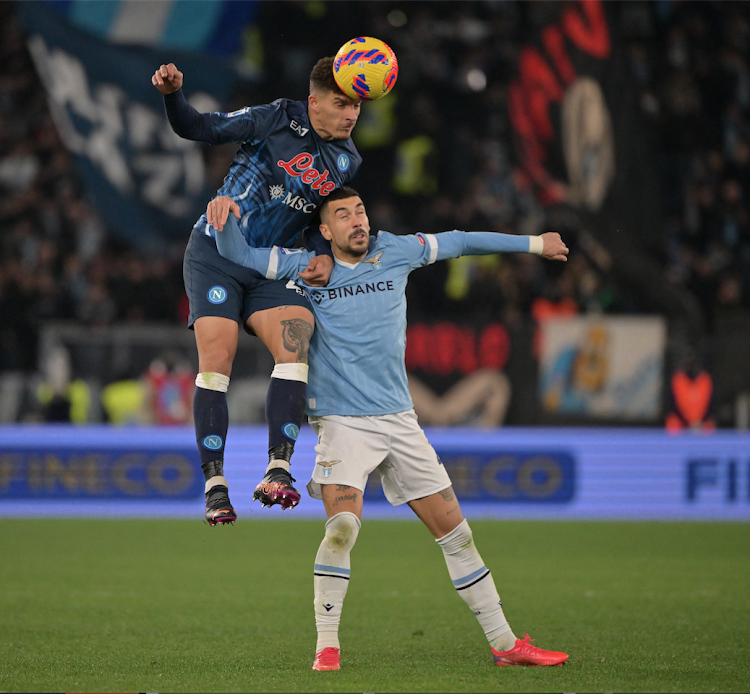 Napoli's Giovanni Di Lorenzo in action with Lazio's Mattia Zaccagni