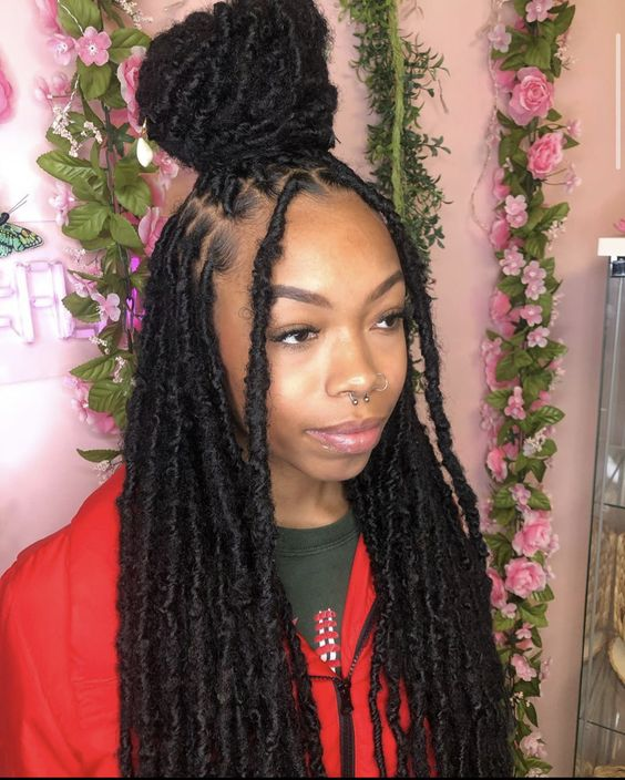 Lady wraps her locs in a half up half down style