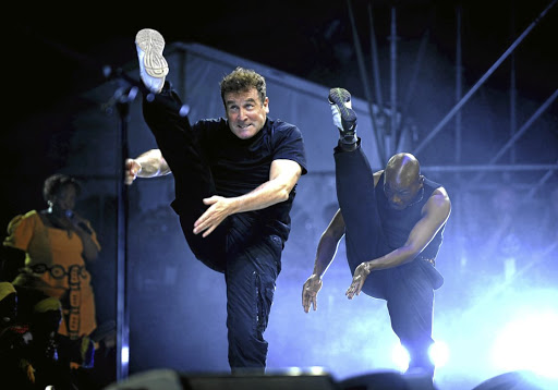 Johnny Clegg performs isicathamiya zulu dance.