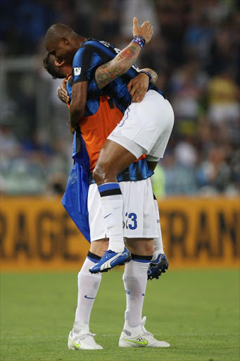 Eto' with his teammate Marco Materazzi of FC Internazionale Milano celebrate after scoring the opening goal during the Tim Cup final between FC Internazionale Milano and US Citta di Palermo at Olimpico Stadium on May 29, 2011 in Rome, Italy