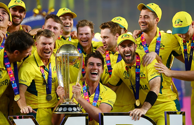 Australia captain Pat Cummins lifts the 2023 ICC Cricket World Cup trophy after victory in the final against India at Narendra Modi Stadium in Ahmedabad, India on November 19 2023.