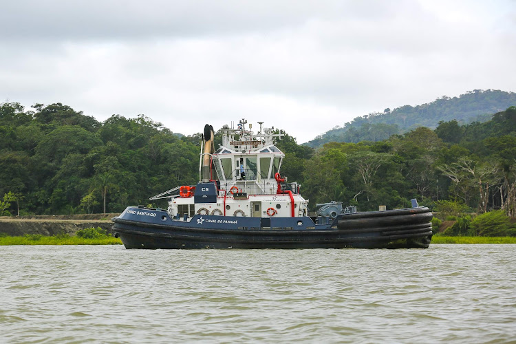  A tugboat seen from Norwegian Jade in Gatun Lake, Panama. 