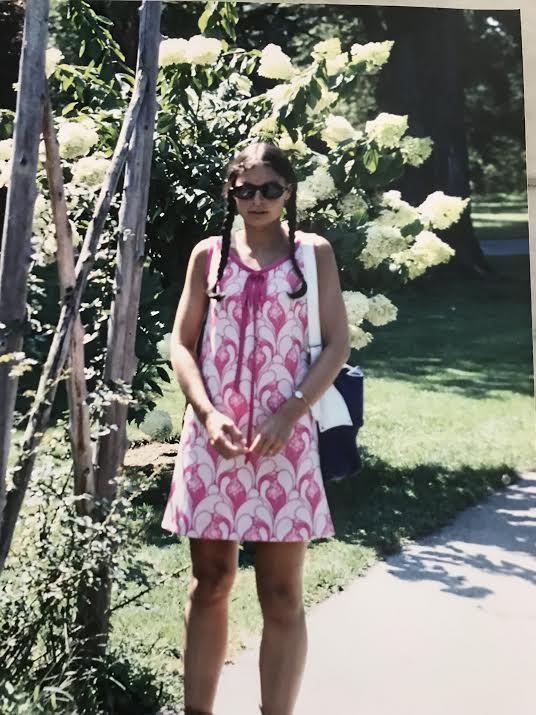 A person standing next to a tree</p>
<p>Description automatically generated