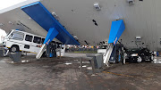 Three vehicles were damaged when a roof at a petrol station collapsed.