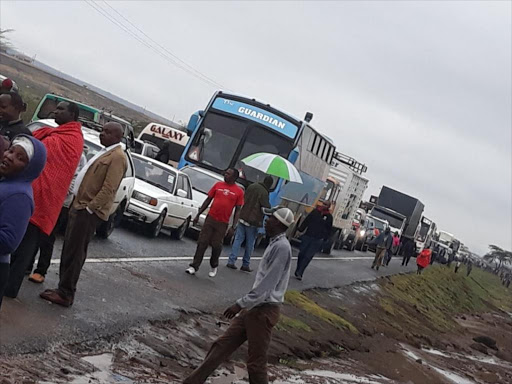 Motorists stuck on Nairobi-Nakuru road after an accident caused a traffic jam on Sunday. /COURTESY