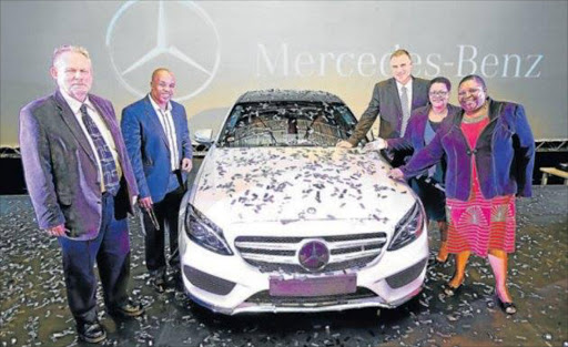 IN A CLASS OF ITS OWN: Trade and Industry Minister Rob Davies, Eastern Cape premier Phumulo Masualle, MBSA CEO Arno van der Merwe, BCM mayor Zukiswa Ncitha and former premier Noxolo Kiviet at the Mercedes-Benz C-Class production line launch earlier this year. The vehicle won the Pe o p l e ’s Wheels award for best family-friendly car yesterday Picture: MARK ANDREWS