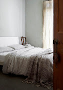 This bedroom embraces a host of subdued tones and tactile natural textures.