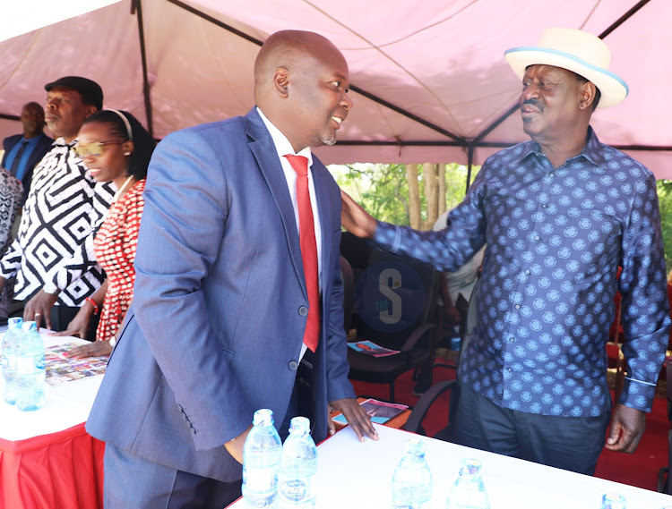 Kitui Deputy Governor Augustine Kanani and Azimio leader Raila Odinga during burial service for the late Gabriel Wambua, brother to Azimio’s spokesperson Makau Mutua at St Patrick’s Catholic grounds Mutuni in Changwithya East, Kitui Central on February 21.