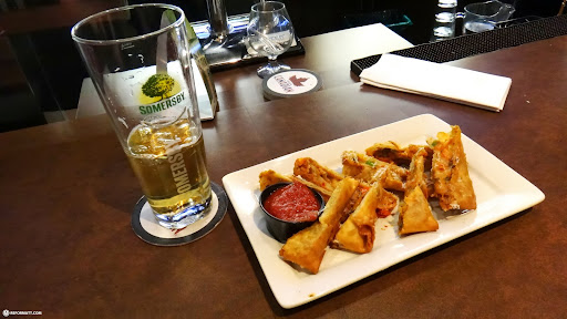 somersby beer and a pizza spring roll in Toronto, Canada 