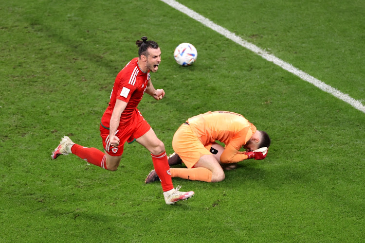 Gareth Bale of Wales celebrates after scoring their team's first goal via a penalty past Matt Turner of United States during the FIFA World Cup Qatar 2022 Group B match between USA and Wales at Ahmad Bin Ali Stadium on November 21, 2022 in Doha, Qatar.