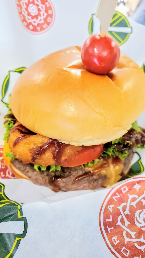 Besides the classic pizzas and hot dogs I've already mentioned, look for rotating burgers of the month (example here is a Western Burger with bacon, cheddar, onion ring, bbq sauce), tots, Cuban sandwiches, and turkey and brie paninis among the food offerings at the new Providence Park.