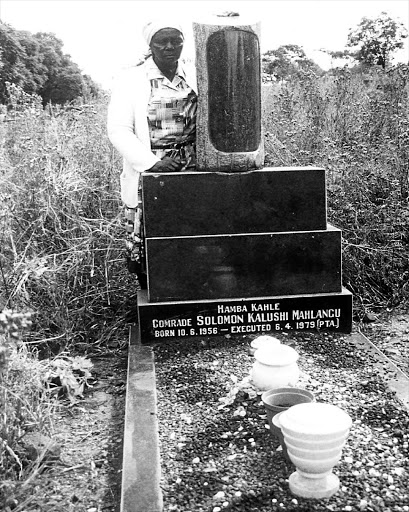 MOTHER'S MOURNING: Martha Mahlangu at the grave of her son in 1993