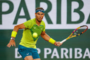 Rafael Nadal of Spain hits a forehand against Corentin Moutet of France in the second round of the French Open at Roland Garros in Paris on May 25, 2022.