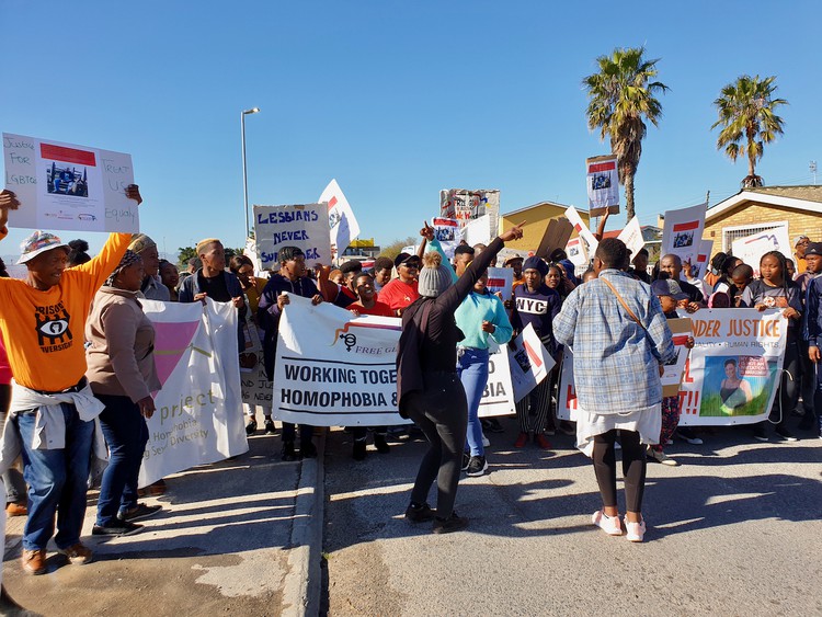 About 60 people with placards reading “Homophobia hurts” and “Stop killing our brothers and sisters” marched through the streets of Gugulethu to the police station in Manenberg on Friday.