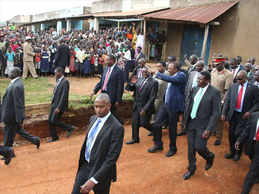 President Uhuru Kenyatta accompanied by western region leaders arrive for the official opening of the Lwakhakha Border Post, Bungoma County on November 16,2015.Photo PSCU