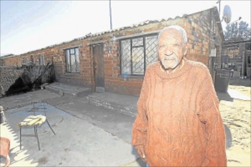 WORRIES OVER: Khuzani Mahlangu stands in front of his house that has been returned to him after a lengthy battle. His son had used the title deed for surety without his permission. PHOTO: VELINHLAPO