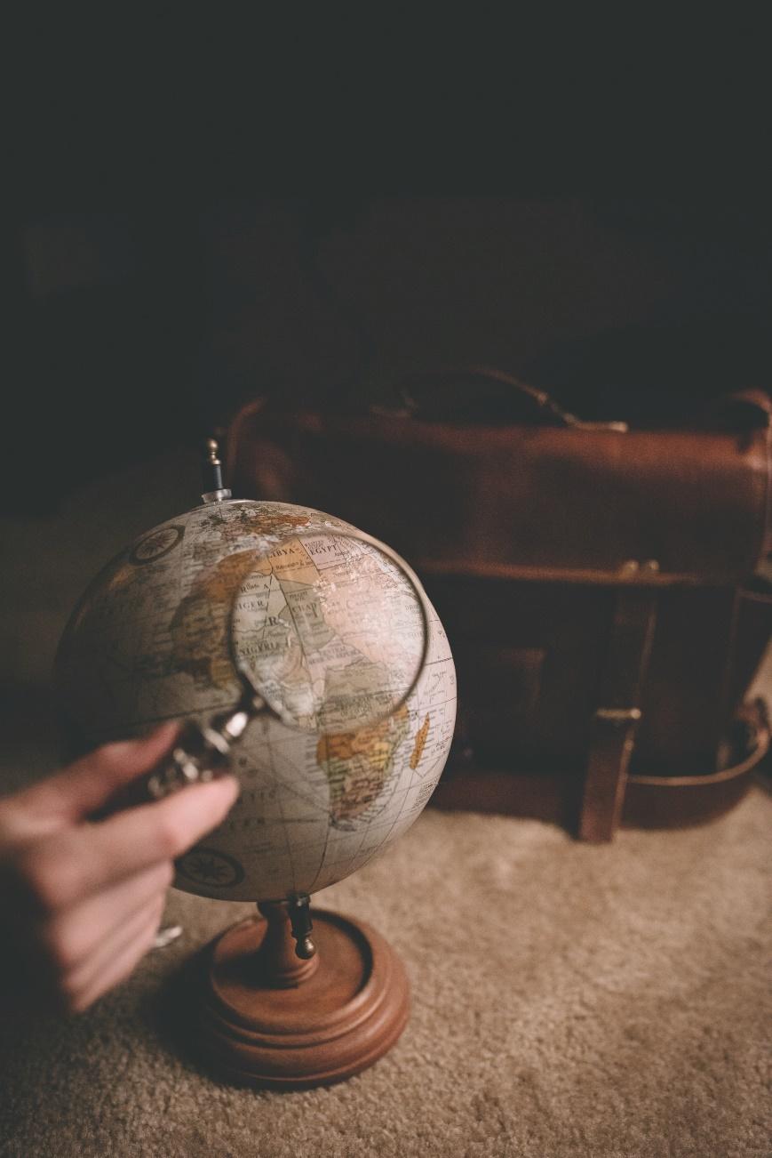 Searching a globe with a magnifying glass