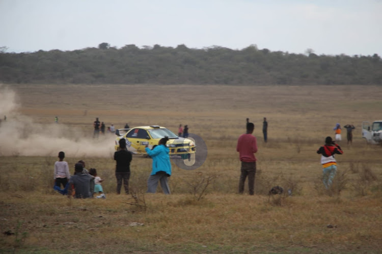 Kenyans watching the WRC Safari Rally 2024 1st round at Elementaita Soysambu view point on March 30, 2024.