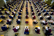 Students sit in during the first day of the National Senior Certificate Examination at Bellville High School on November 05, 2020 in Bellville, South Africa.