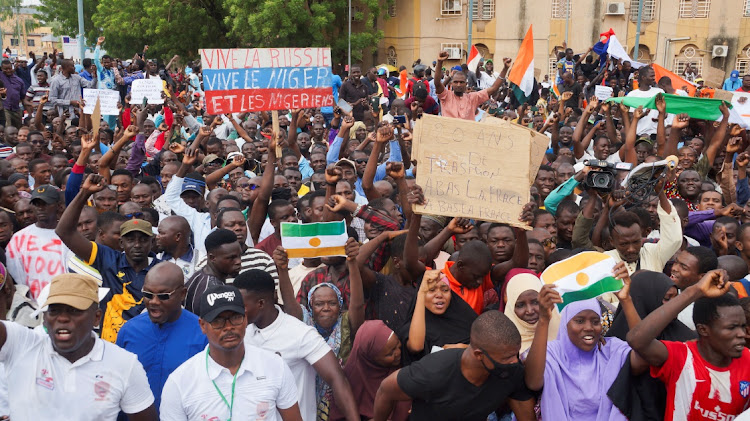 Anti-sanctions protestors gather in support of the putschist soldiers in the capital Niamey, Niger, on August 3 2023. The signs read "Long live Niger, long live Russia, 20 years of transition down with France".