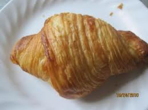 Baked croissant. Cut off tip  hollow out inside dough and fill with the egg or other salad of your choice.