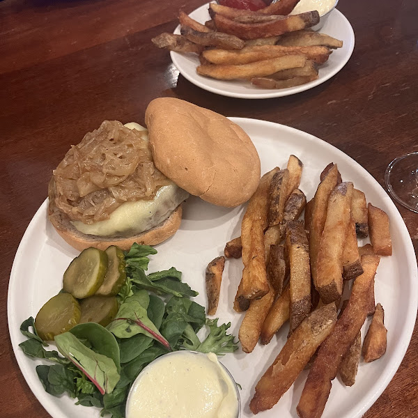 Burger with carmelized onions and side of fries