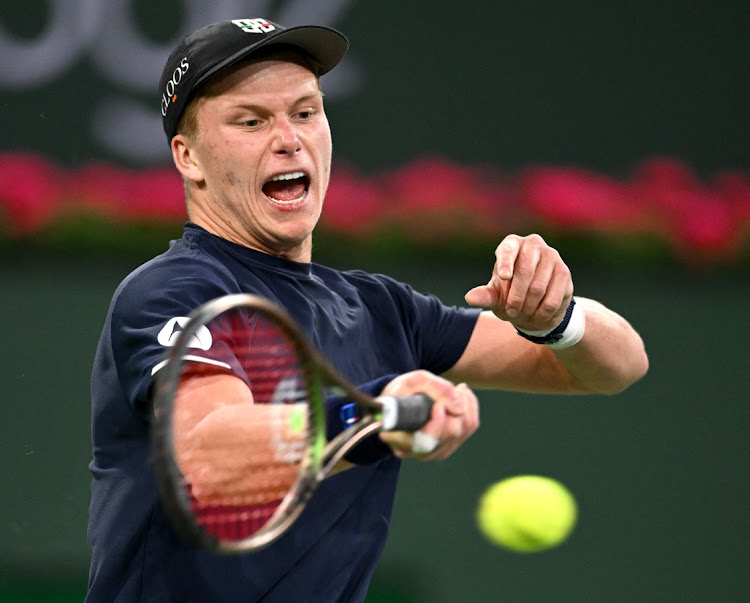 Jenson Brooksby (US) hits a forehand in his third round match against Stefanos Tsitsipas during the BNP Paribas Open at the Indian Wells Tennis Garden in Indian Wells, California on March 14, 2022