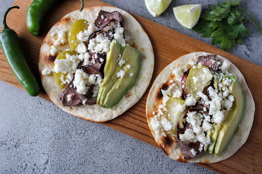 Two Grilled Steak and Veggie Tacos ready to eat.