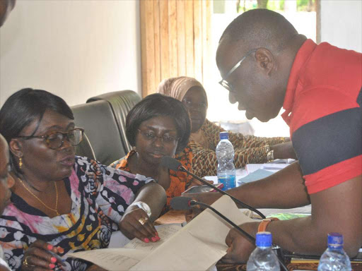 Kilifi North MP Owen Baya speaks to NLC acting chairperson Abigael Mbagaya at Watamu CDF Hall on October 11, 2018. /ALPHONCE GARI