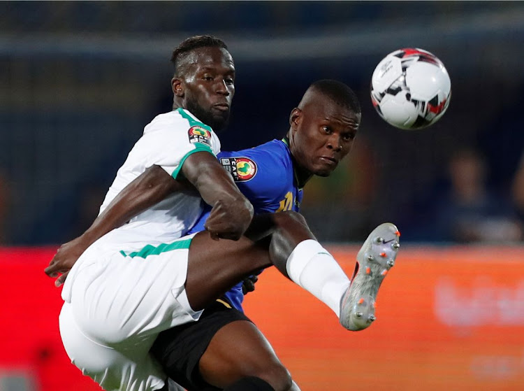 Tanzania's Mbwana Samatta in action with Senegal's Salif Sane.